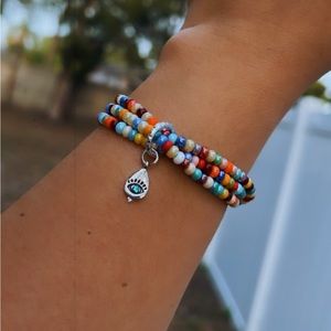 Handmade multicolored triple beaded bracelet